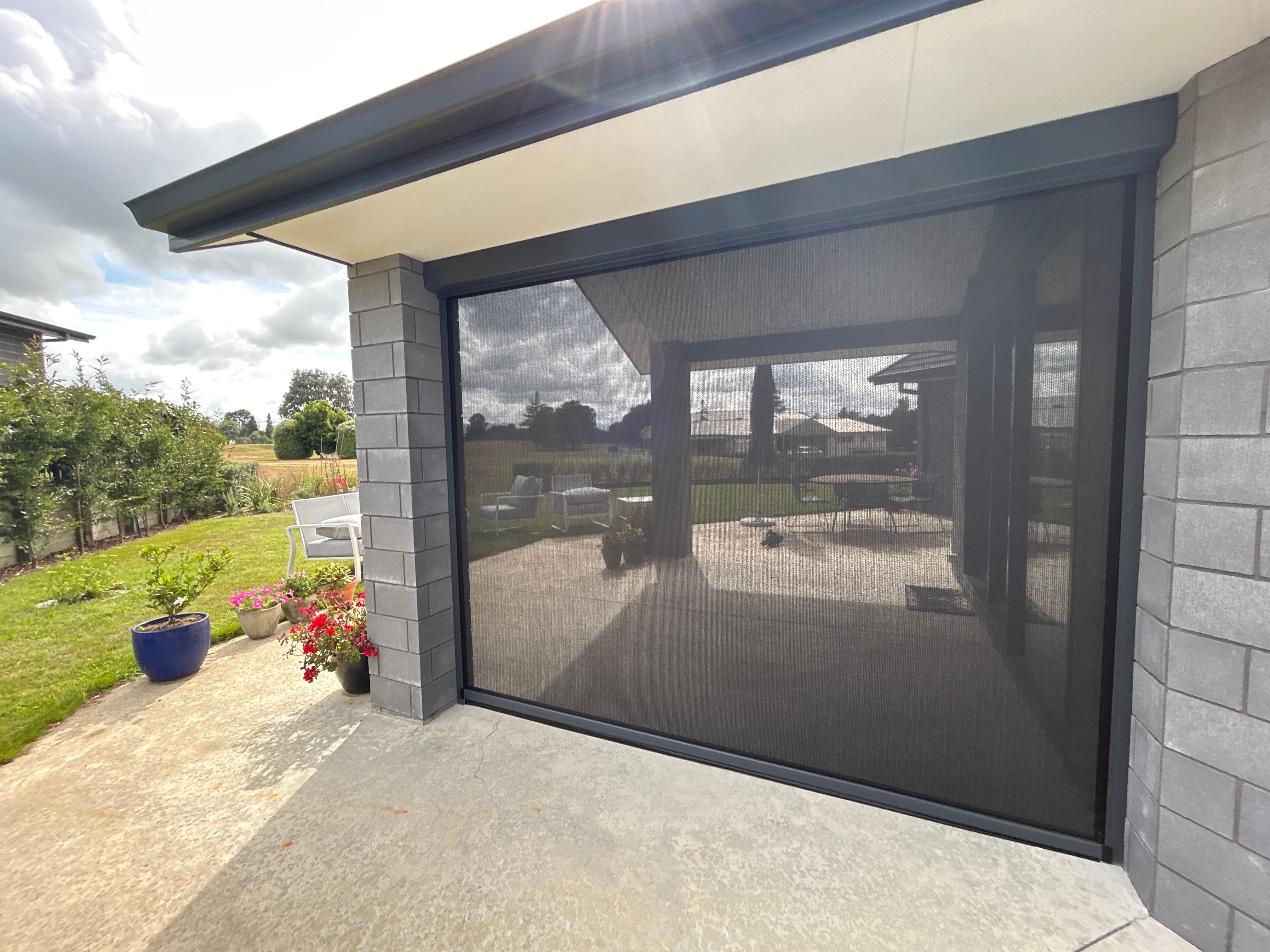 Ziptrak blinds installed alongside a pergola